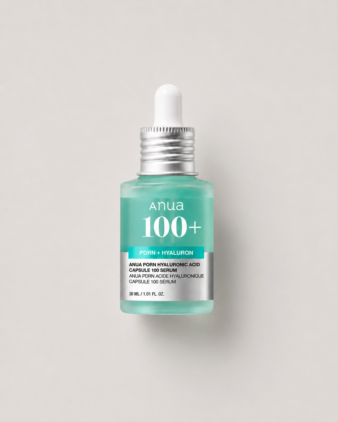 Korean skincare - Anua PDRN Hyaluronic Acid Capsule 100 Serum 30ml in a mint-green dropper bottle on a light greige background.