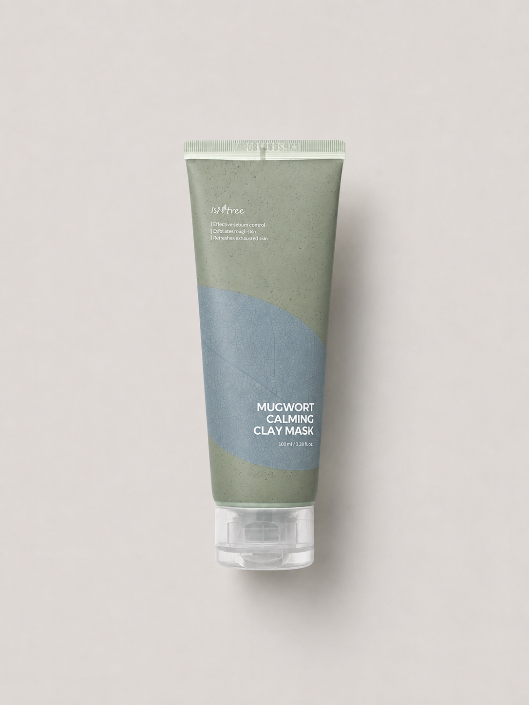 A korean skincare tube of Isntree Mugwort Calming Clay Mask, featuring a sage green and dusty blue color-blocked design with a clear cap, set against a solid light gray background. 100 ml.