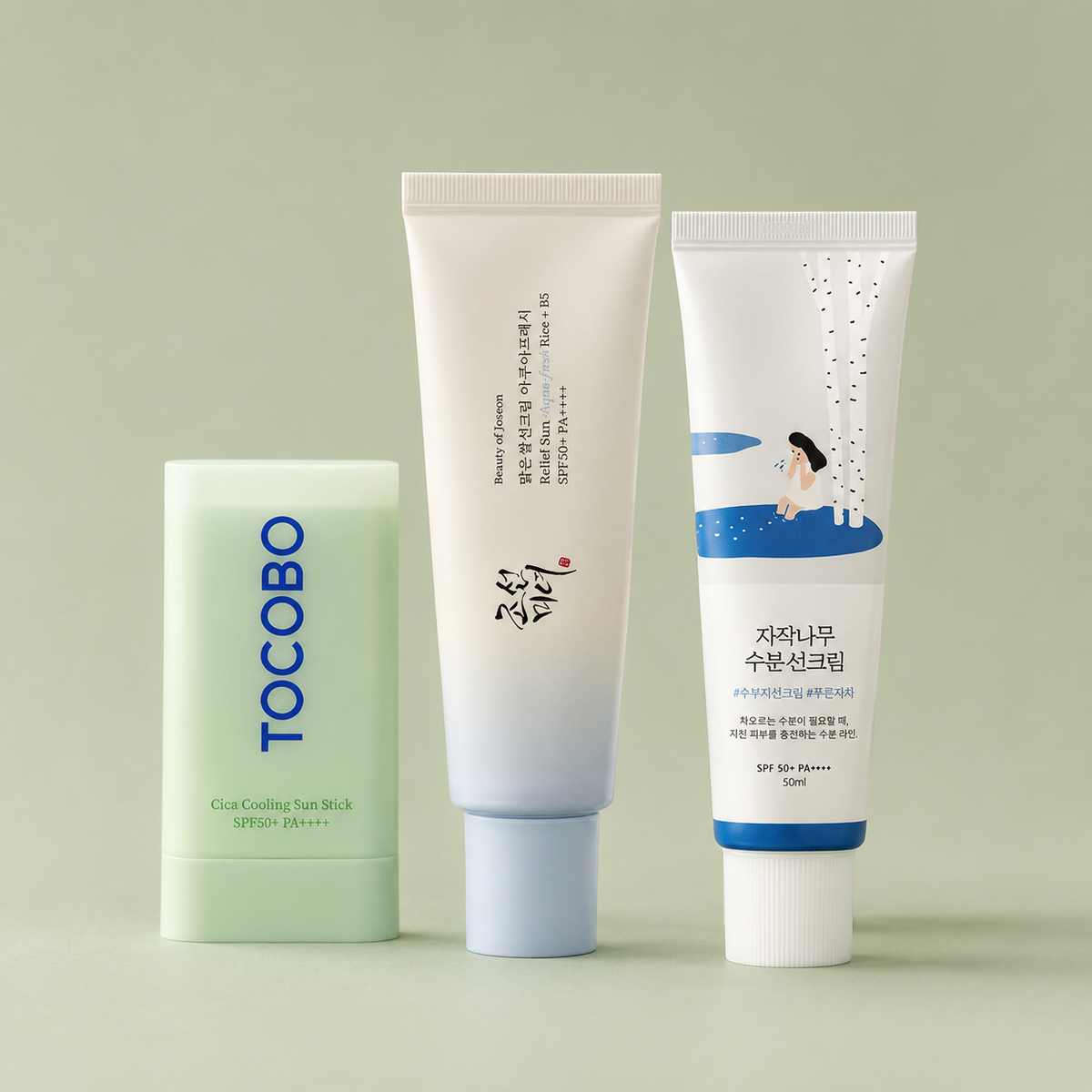 Korean sunscreen products on a soft olive background