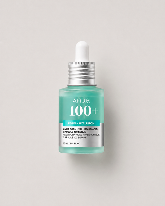 Korean skincare - Anua PDRN Hyaluronic Acid Capsule 100 Serum 30ml in a mint-green dropper bottle on a light greige background.