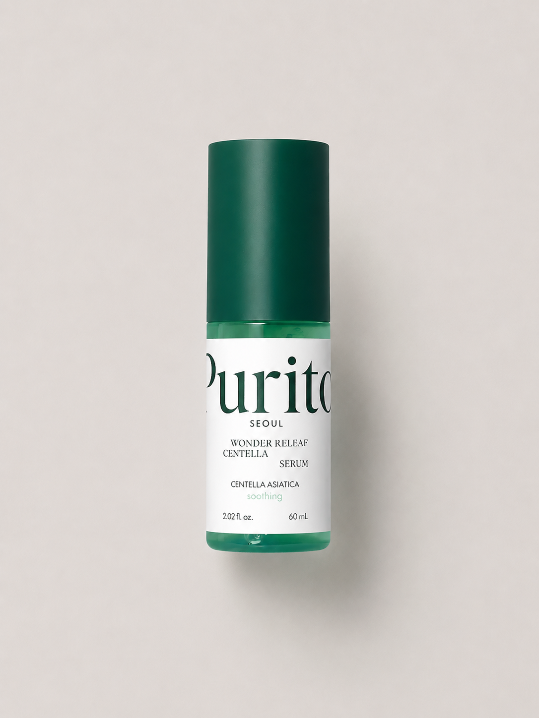 A korean skincare serum - Purito Seoul Wonder Releaf Centella Serum, featuring a dark green cap and a white label with green text, set against a solid light gray background. 60 ml.