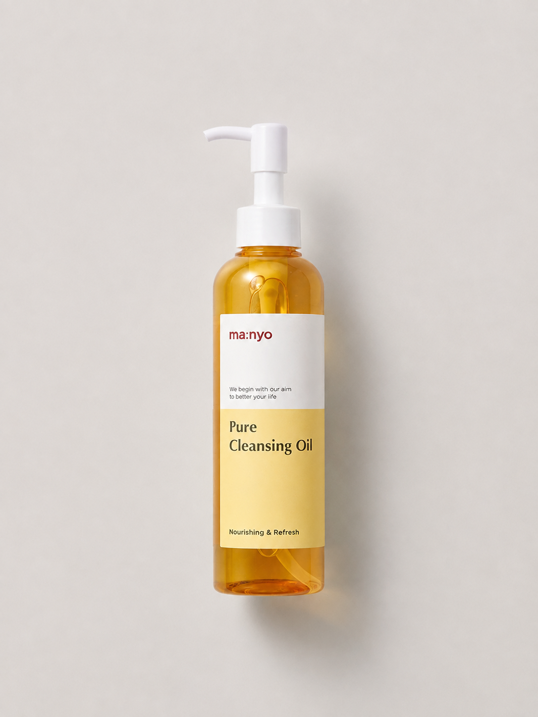 A bottle of korean skincare oil -  manyo Pure Cleansing Oil with a white pump dispenser, set against a solid light gray background. 200 ml.
